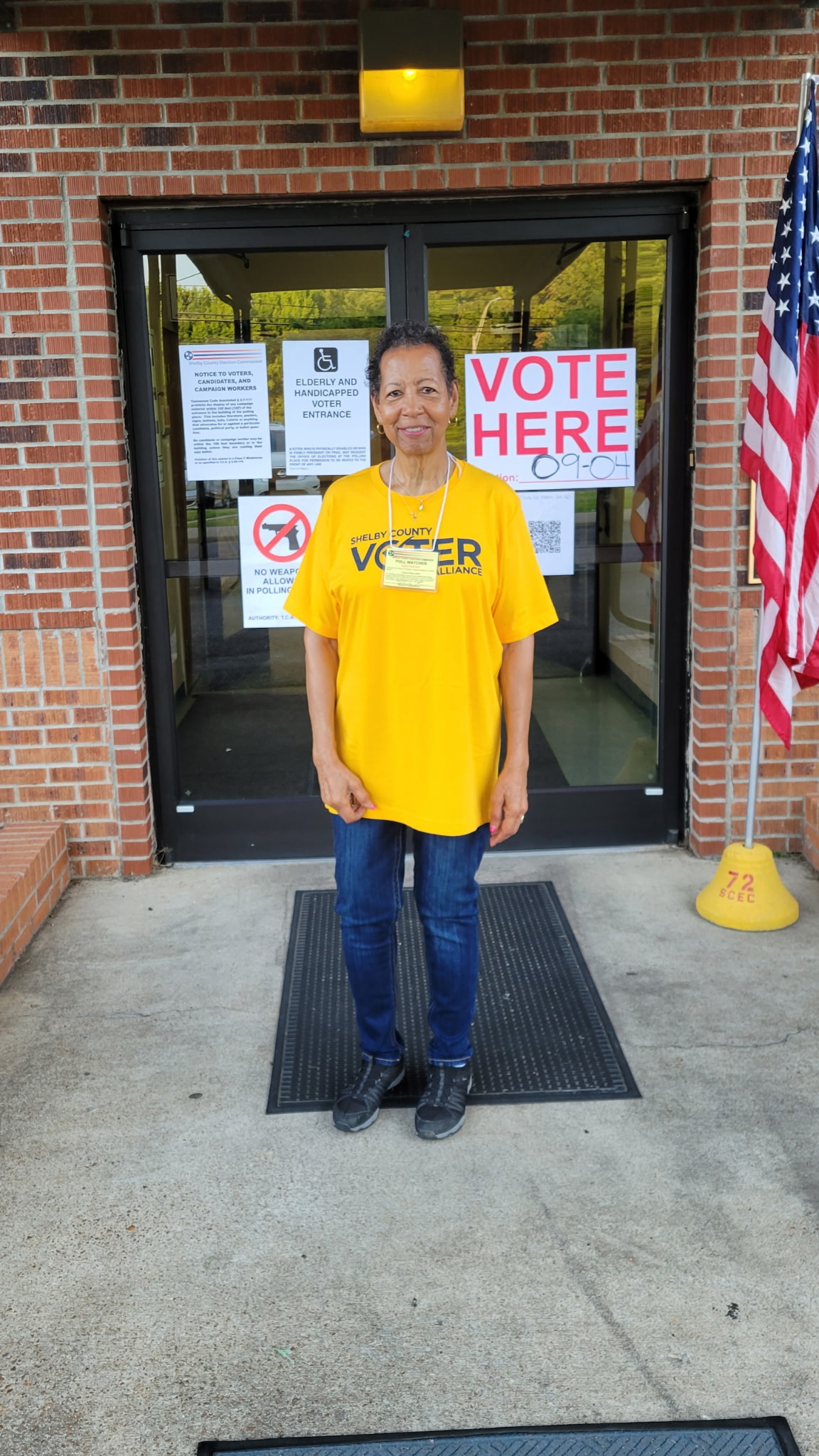 A poll watcher standing outside a Shelby County voting location
